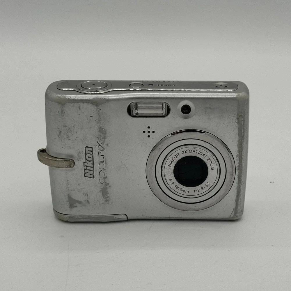 Nikon Coolpix L10 Silver Digital Camera 5.0MP 3x Optical Zoom Bundle Working